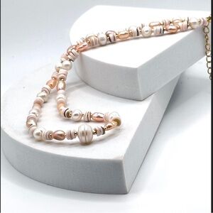 Sweet Blush colored pearl nugget
necklace with gold beads and Natural Shell.